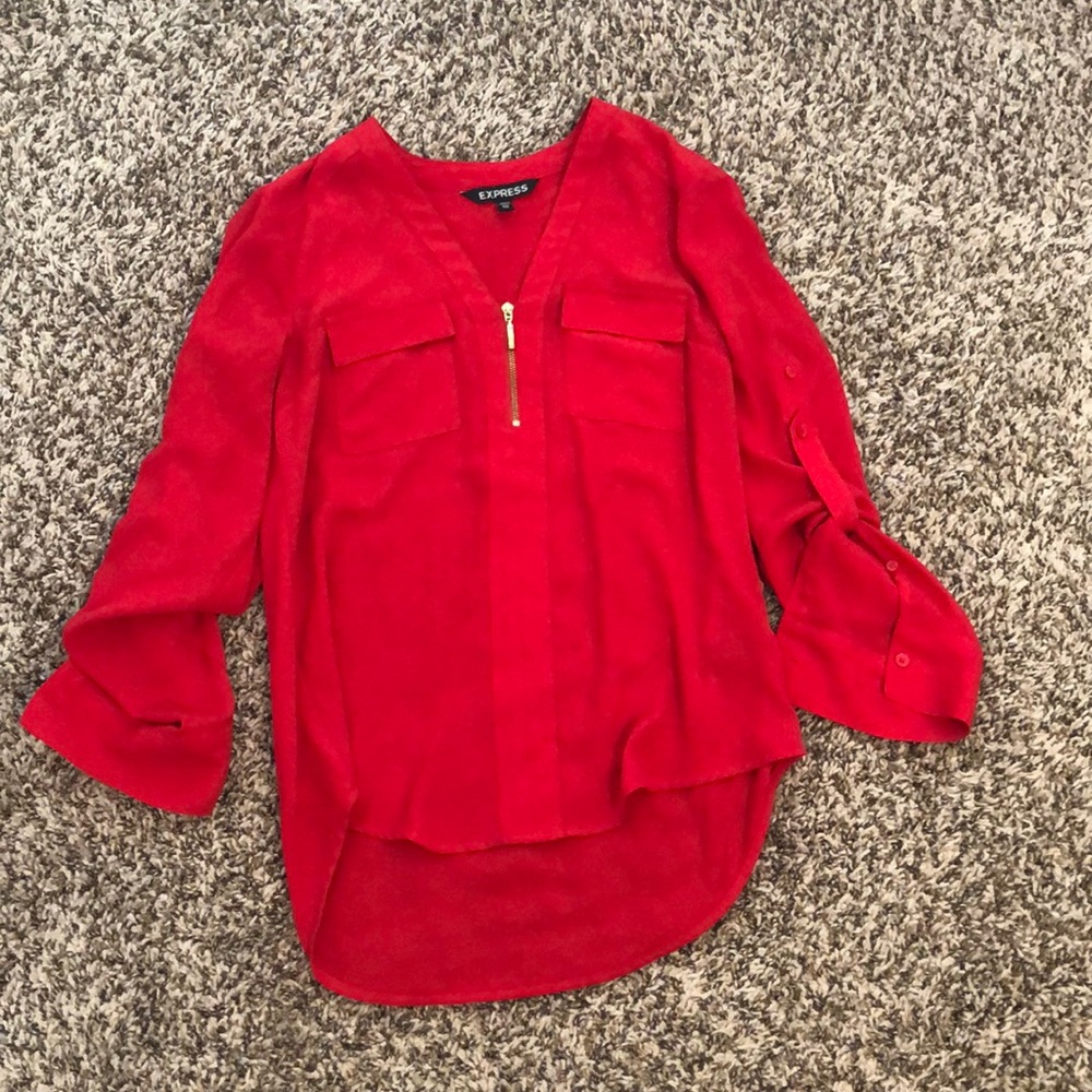 Red/orange zip up top.